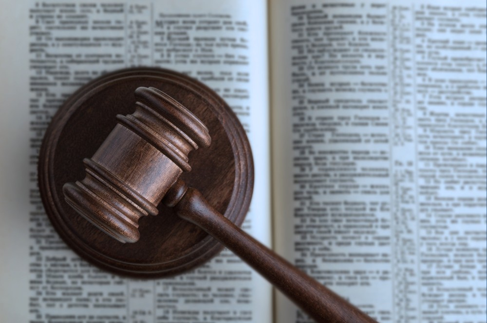 gavel laying on top of an open book